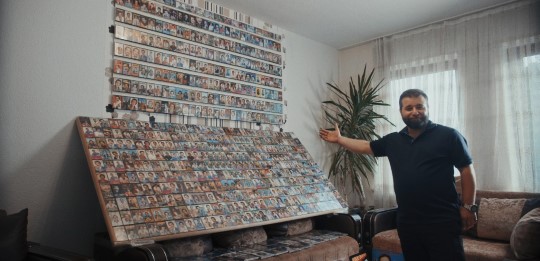 A fan shows his collection on audio tapes