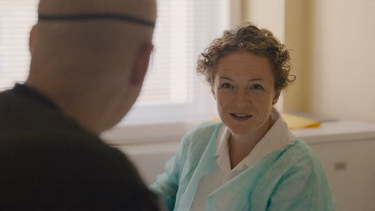  Kateřina Rusinová in conversation with a patient