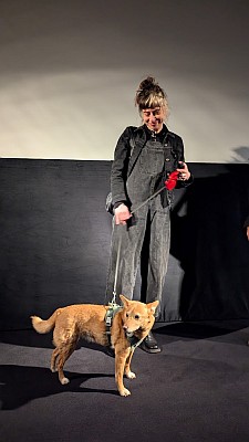 picture from director at screening with dog
